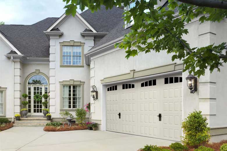 White House with a garage door with raised panels